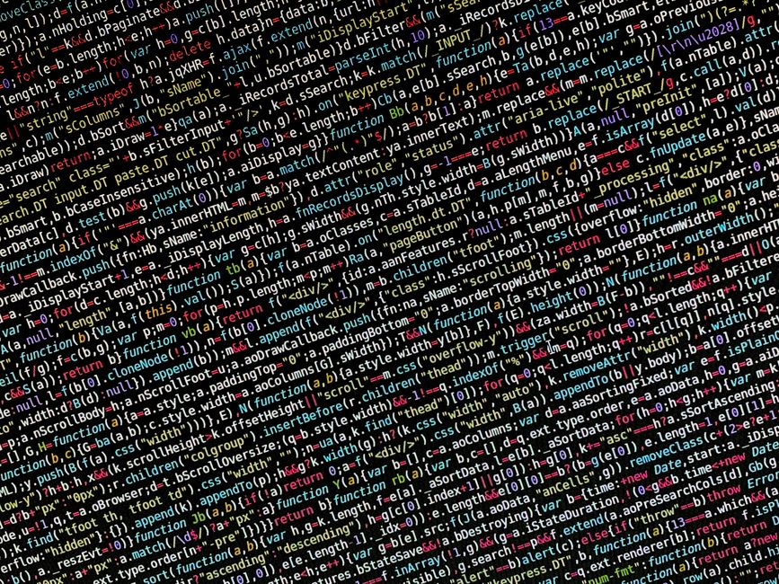 In the image, there is a close-up view of a computer screen displaying HTML code with various tags and attributes in different colors. The code appears to be part of a webpage layout, with visible tag